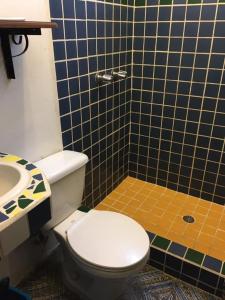 a bathroom with a toilet and a sink at Casa Jaguar in Copán Ruinas