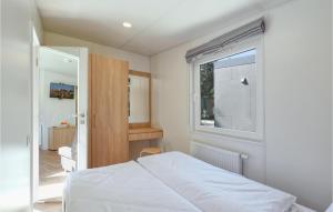 Postel nebo postele na pokoji v ubytování Tiny Haus 35 Am Brombachsee