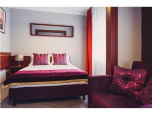 Łóżko lub łóżka w pokoju w obiekcie Hotel Chmielna Warsaw