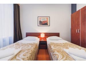 Łóżko lub łóżka w pokoju w obiekcie Hotel Chmielna Warsaw