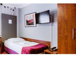 Łóżko lub łóżka w pokoju w obiekcie Hotel Chmielna Warsaw