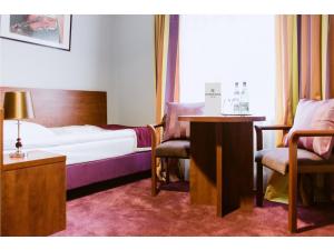 Łóżko lub łóżka w pokoju w obiekcie Hotel Chmielna Warsaw