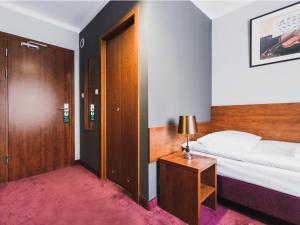 Łóżko lub łóżka w pokoju w obiekcie Hotel Chmielna Warsaw