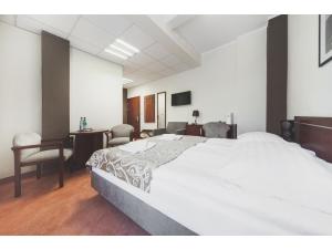 Łóżko lub łóżka w pokoju w obiekcie Hotel Chmielna Warsaw