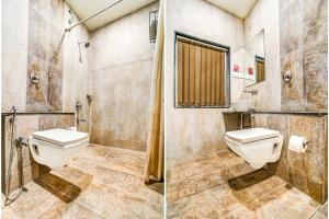 a bathroom with a toilet and a shower at FabHotel Global Inn I Aurangabad Railway Station in Aurangabad