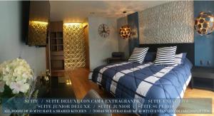 a bedroom with a blue bed with striped pillows at Business SUITES KEPLER in Mexico City
