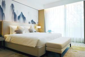 Postel nebo postele na pokoji v ubytování Metropark Hotel Hongqiao Shanghai