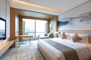 Postel nebo postele na pokoji v ubytování Metropark Hotel Hongqiao Shanghai