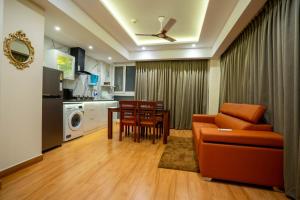 a living room with a couch and a table at AS Inn in Cochin