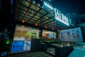 a store front of a building at night at AS Inn in Cochin