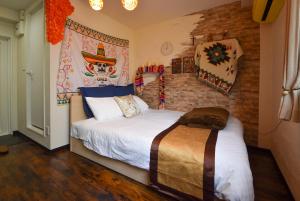 Postel nebo postele na pokoji v ubytování Comfy Stay Sakuramachi
