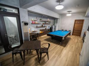 a room with a pool table and ping pong ball at 48-6 Homestay in Xincheng