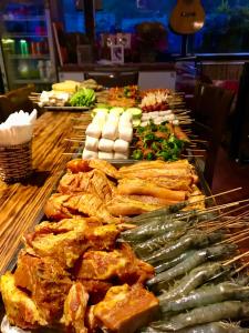 a buffet with many different types of food on a table at Fansipan Terrace Cafe and Homestay in Sa Pa