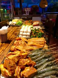 a buffet with many different types of food on a table at Fansipan Terrace Cafe and Homestay in Sapa
