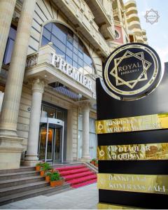 a building with a sign in front of it at Premier Palace Baku in Baku