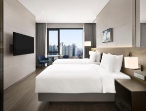 Postelja oz. postelje v sobi nastanitve Four Points by Sheraton Suwon