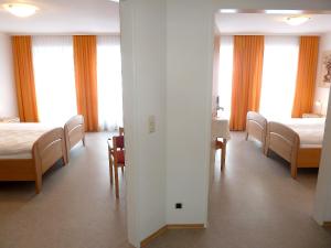 Postel nebo postele na pokoji v ubytování Garni Hotel Leitl GmbH
