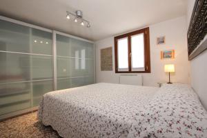 a bedroom with a bed and a window at City Apartments Cannaregio in Venice