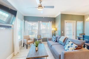 a living room with a couch and a table at Whitecap Retreat in Padre Island