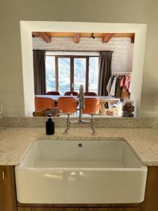 a white sink in a kitchen with a counter top at Chalet Ameo in Valdeblore
