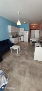 a living room with a couch and a table at Northern Cyprus Trikomo, Iskele, Long Beach, Caesar Resort 4 in İskele
