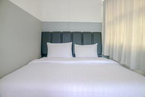 Katil atau katil-katil dalam bilik di 360 Homestay Padang