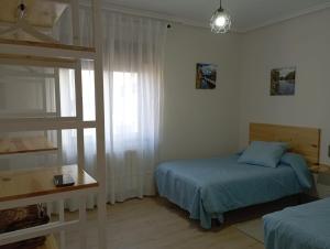 Postel nebo postele na pokoji v ubytování La Casa del Limonero