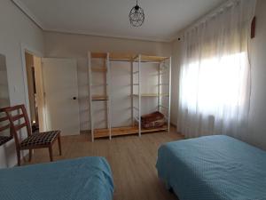 Postel nebo postele na pokoji v ubytování La Casa del Limonero