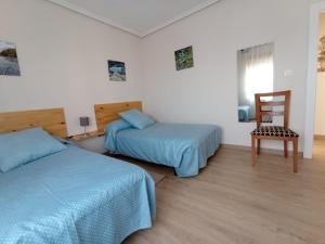 Postel nebo postele na pokoji v ubytování La Casa del Limonero
