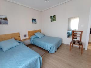 Postel nebo postele na pokoji v ubytování La Casa del Limonero