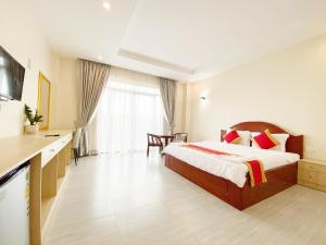 Postel nebo postele na pokoji v ubytování Sopheak Mongkol Guesthouse + 37 fotografií