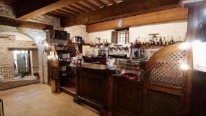 a kitchen with a bar in a room at Borgo de' Varano by Hotel I Duchi in Camerino
