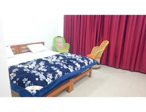 Cama ou camas em um quarto em Hotel Dev Bhoomi, Uttarkashi