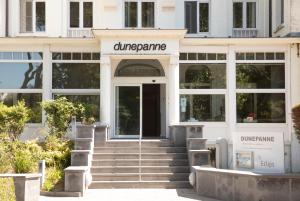 a building with the entrance to achromane synagogue at Hotel Dunepanne in De Haan