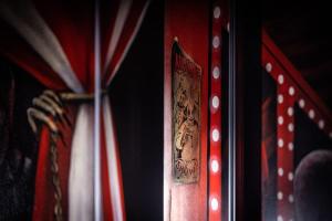 a close up of a door with a flag at Le Cirque Ensorcelé - Le Studio Maudit & Cosy in Belfort