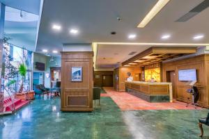 a lobby with a podium in the middle of a building at Hotel Ambient in Braşov