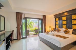 Voodi või voodid majutusasutuse Phi Phi Andaman Legacy Resort toas