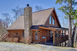 a large log cabin with a chimney on it at Serenity, A Rustic Log Cabin Retreat in Sevierville
