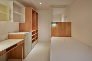 a bedroom with a large bed in a room at Mangrove Sinseol in Seoul