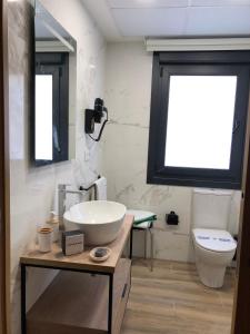 a bathroom with a sink and a toilet at Hotel Villa México 