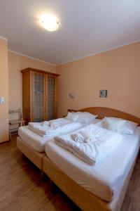 Postel nebo postele na pokoji v ubytování Villa-Senta-Apartment-7