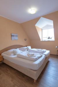 En eller flere senge i et værelse på Villa-Senta-Apartment-14