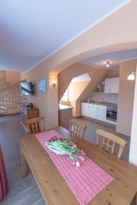 a table with vegetables on it in a kitchen at Villa-Senta-Apartment-15 in Kühlungsborn