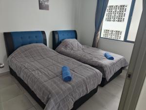 Postelja oz. postelje v sobi nastanitve Sandakan Grand Seaview 3R2B