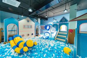 a childs play room filled with blue balls at D'Lioro Hotel & Resort in Ha Long