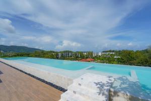 a large swimming pool on top of a building at Skypark Apartments by Laguna Phuket in Bang Tao Beach