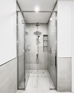 a shower with a glass door in a bathroom at Luxury 2 bedroom apartment in Madinat Jumeirah Living in Dubai