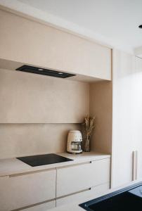 a kitchen with a toaster on a counter at Vakantiewoning number 44 in Ypres