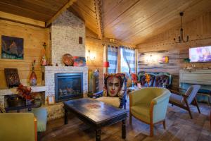 a living room filled with furniture and a fireplace at Cit'Hotel Le Montreal in Châlons-en-Champagne