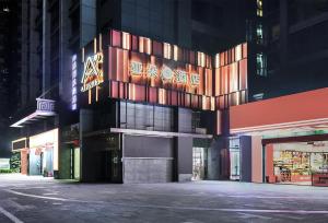 a building with a sign on the side of it at Atour S Hotel Chongqing Jiefangbei Hongyadong Riverview in Chongqing